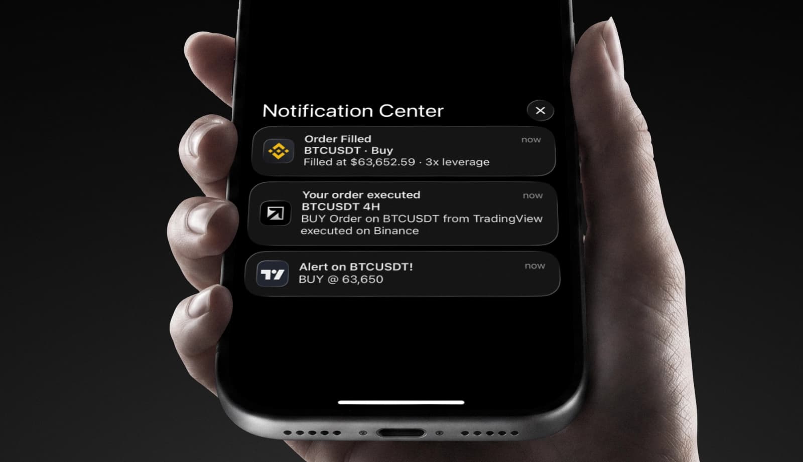 A phone showing the notification trail from a Vektor alert on TradingView through to an order filled on Binance.